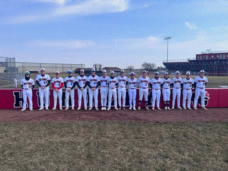 Huntley's seniors in front of the new backstop.