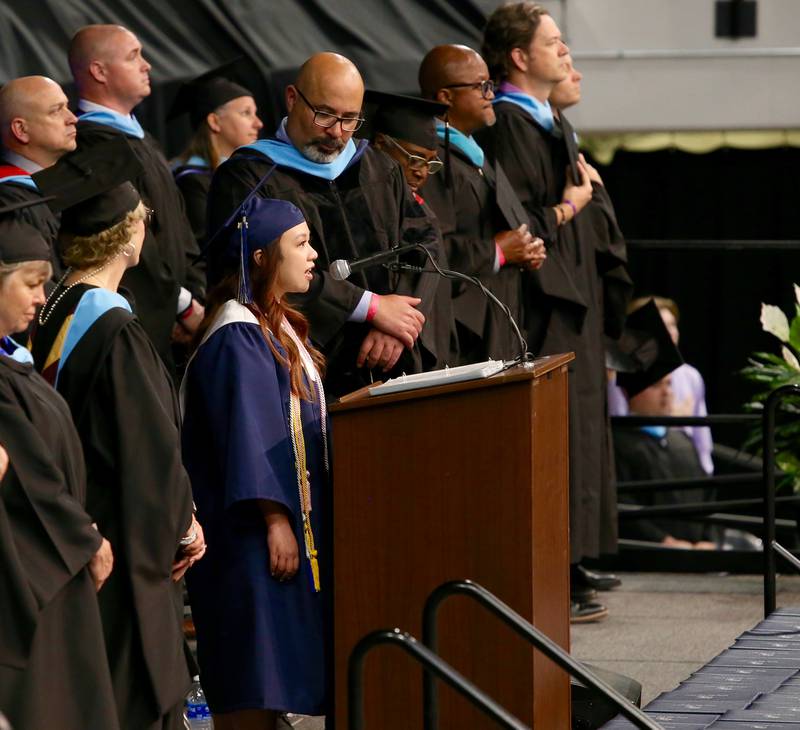 Ysabelle De Los Santos signs the National Anthem at the Oswego East High School Class of 2024 Commencement Ceremony on Saturday, May 18, 2024 in DeKalb.