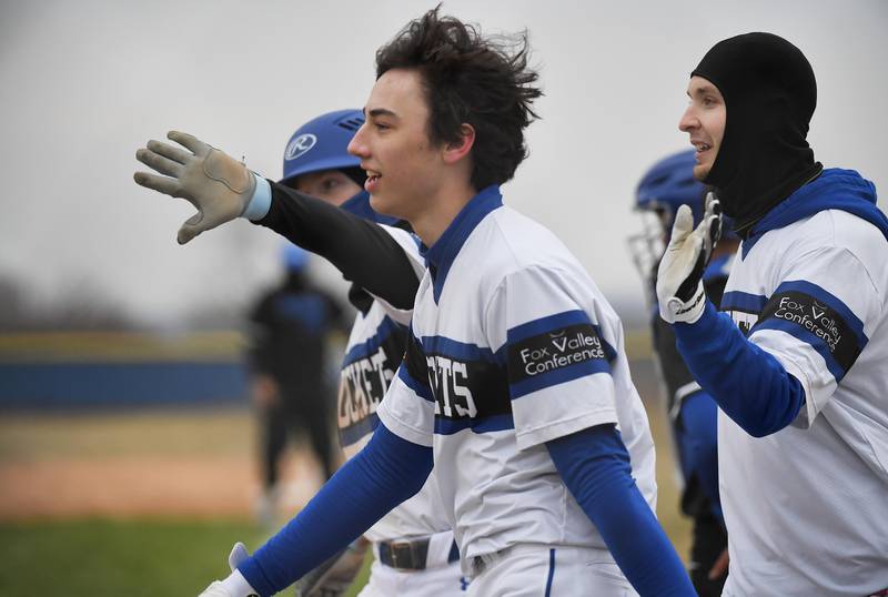 Burlington Central’s AJ Payton is congratulated after his game-winning home run against Larkin in a baseball game in Burlington on Friday, March 24, 2023.