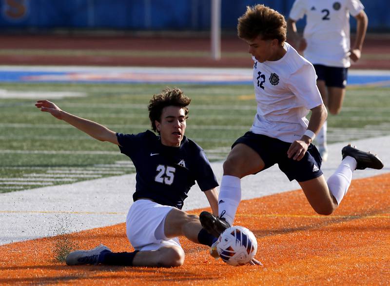 Belleville Althoff Catholic's Hayden Tell kicks the ball away from Lemont’s Billy Eliadis during an IHSA Class 3A state semifinal soccer match on Friday, Nov. 8, 2024, at Hoffman Estates High School.