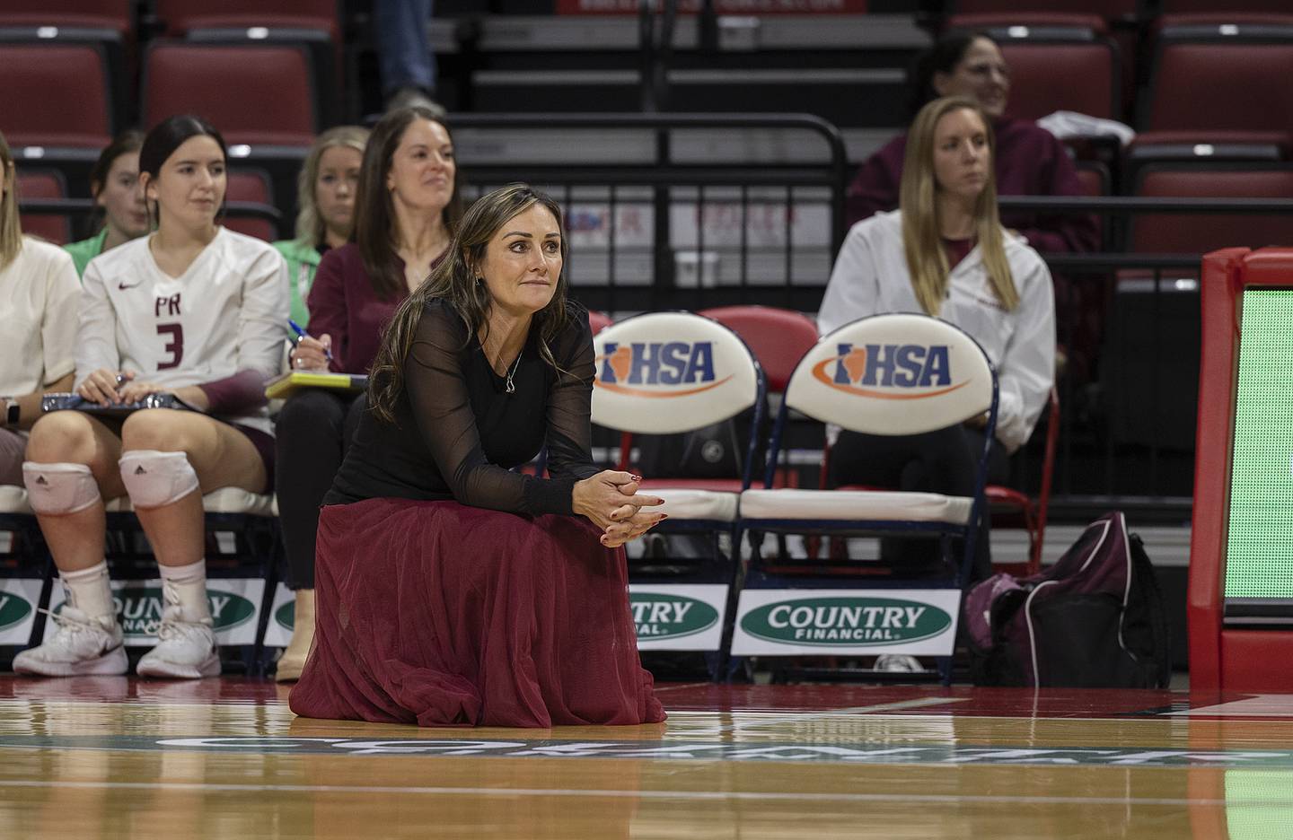 Prairie Ridge's Head Coach Hilary Agnello watches her team against DePaul College Prep Saturday, Nov. 16, 2024, in the Class 3A third place state volleyball match at CEFCU Arena in Normal.