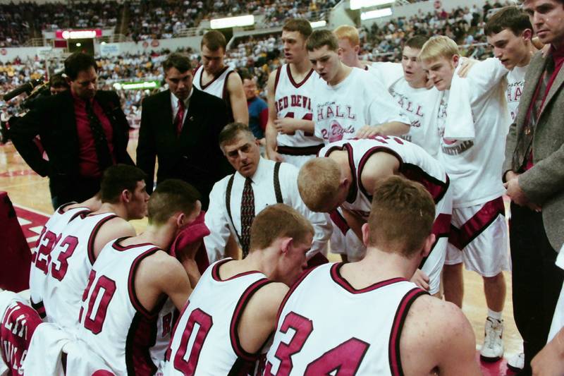 Hall coach Eric Bryant addresses his team during a timeout in 1997-98 state tournament play in Peoria.