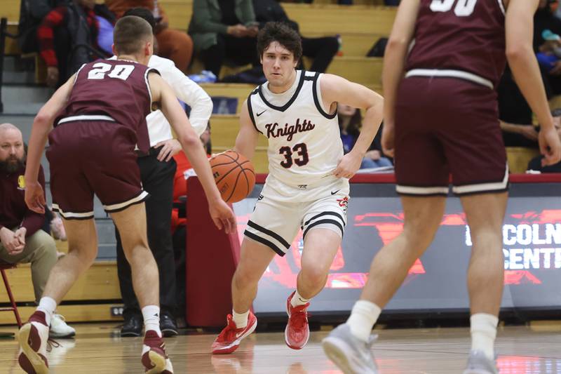 Lincoln-Way Central’s Luke Tingley makes a move against Lockport on Tuesday, Jan. 23rd, 2024 in New Lenox.
