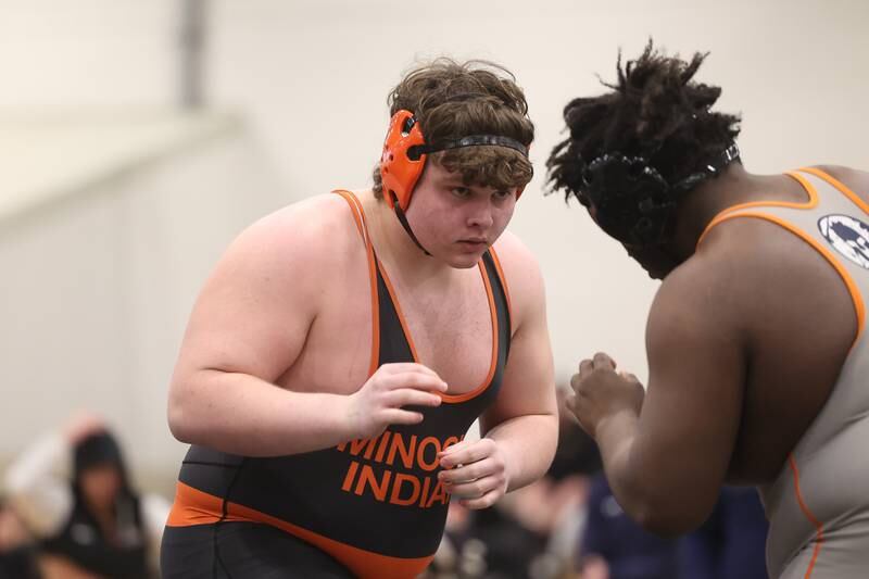 Robbie Murphy of Minooka faces off with Jamir Thomas of Romeoville in the 285-pound weight SPC Conference championship match at Joliet West on Saturday, Jan 25, 2025.