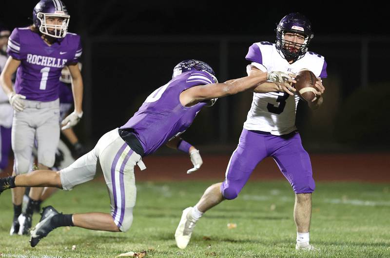 Dixon’s Ryan Ramsdell hauls in a two point conversion in front of Rochelle's Garrett Gensler during their first round playoff game Friday, Oct. 28, 2022, at Rochelle High School.