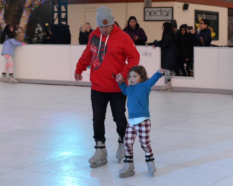 Joseph and Autumn Mora of Chicago enjoy ice skating during the Holiday event held at Brookfield Zoo Saturday Nov 26, 2022.