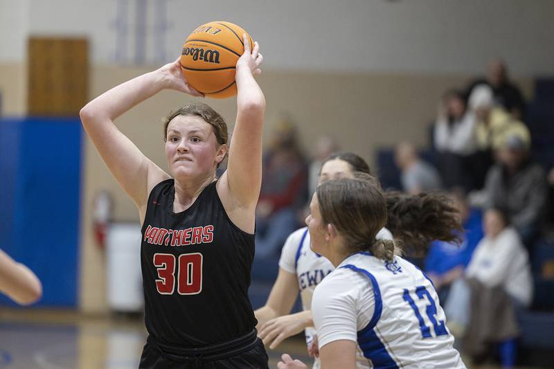 Erie-Prophetstown’s Chloe Stock looks to pass against Newman Thursday, Dec. 12, 2024, at Newman High School.