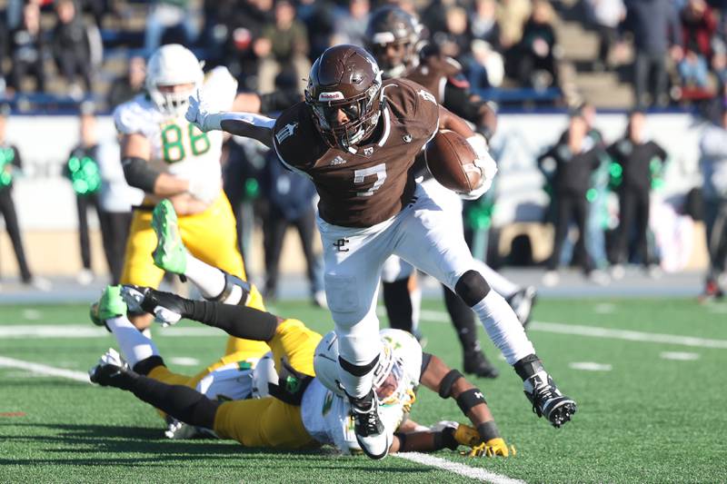 Joliet Catholic’s HJ Grigsby evades a tackle on a run against Providence in the Class 5A semifinal on Saturday, Nov. 18, 2023, in Joliet.
