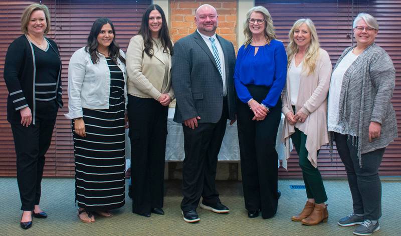 (Left to right); 2025 Excellence in Education Awards presenter Jolene Willis, Natalie Wylde, Kristin Hill, Jared Poynter, Julie Thompson, Elizabeth Peterson, and award presenter Amanda Christensen