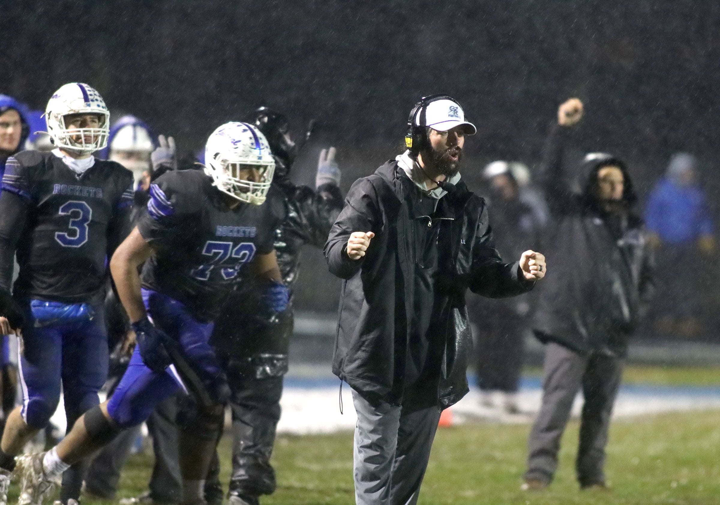 Burlington Central’s players and coaching staff react during win against Harlem in IHSA football Class 6A second-round playoff action at Central High School in Burlington on Saturday, November 8, 2025.