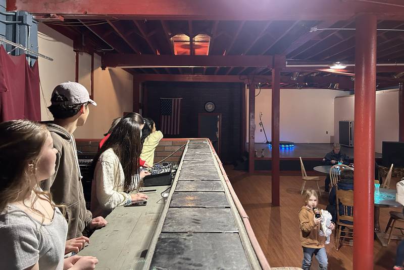 Teens sit at the DJ station at the informational open house at the After Teen Lounge in Oregon on Sunday, Feb. 22, 2026.