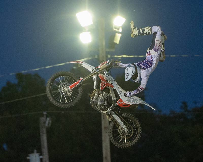 Alex Damlow performs the 'Cliffhanger' trick during the FMX segment of the Monster Truck Bash show on Saturday, Sept. 13, 2025 at the La Salle Speedway in La Salle.