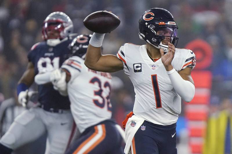 Chicago Bears quarterback Justin Fields looks to pass against the New England Patriots during the first half, Monday, Oct. 24, 2022, in Foxborough, Mass.