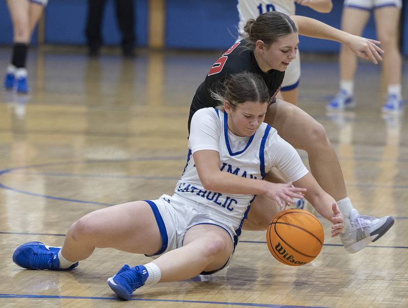 Newman’s Lucy Oetting and Erie-Prophetstown’s Izzy Johnson fight for a loose ball Thursday, Dec. 12, 2024, at Newman High School.