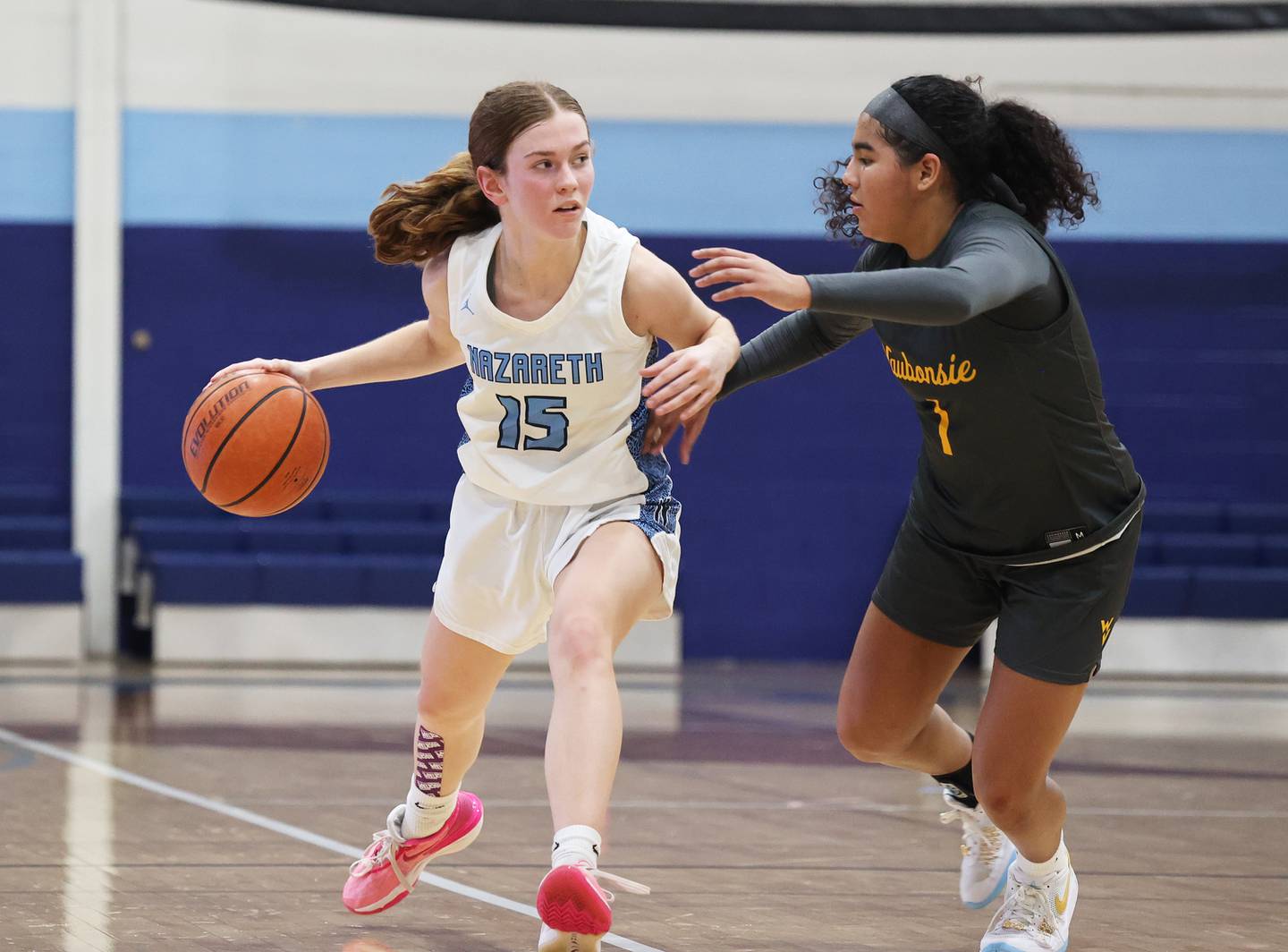 Nazareth’s Mary Bridget Wilson (15) handles the ball against Waubonsie Valley during a girls varsity basketball game on Thursday, Feb. 8, 2024 in La Grange Park, IL.