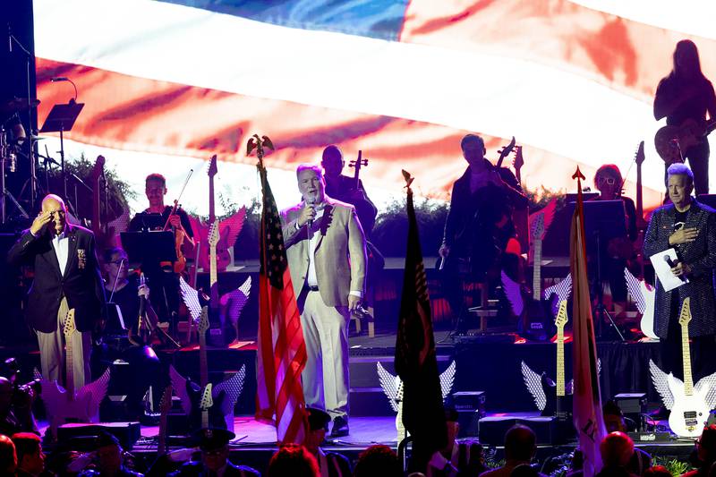 Famed Chicago Blackhawk singer Jim Cornelison leads the crowd in the national anthem Thursday, Aug. 29, 2024, for the opening of the Hard Rock Casino Rockford.