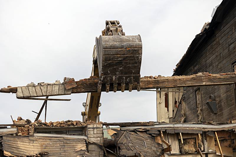 A section of the first floor header is being salvaged by Burke during the demolition Tuesday, Sept. 5, 2023.