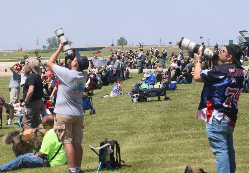 Photographers and observes watch planes fly overhead during the 11th annual TBM Reunion and Air Show on Friday, May 15, 2026 at the Illinois Valley Regional Airport in Peru.