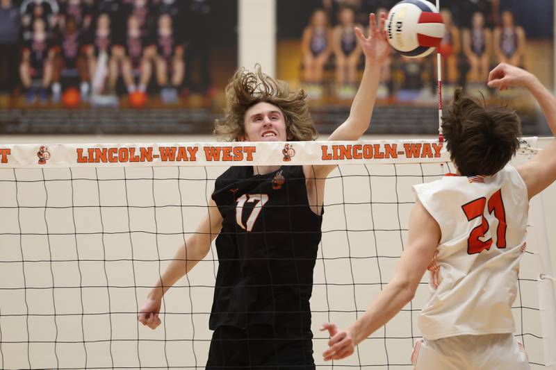 Lincoln-Way West’s Connor Jaral gets a hand on a shot by Plainfield East on Wednesday, March 22nd. 2023 in New Lenox.