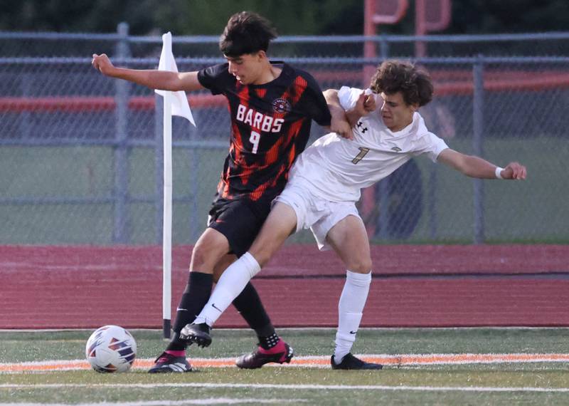 DeKalb's Joaquin Medina-Benitez and Sycamore's Noah Daykin get tangled up going after the ball during their game Thursday, Oct. 10, 2024, at DeKalb High School.