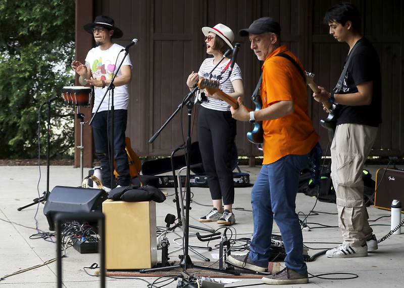 Mi Amigo Hamlet, Alina Celeste, Richard Rankin, and Leo Walsh from the Being Bilingual Rocks (BBR) Band perform during the Crystal Lake Park District and Public Library's Summer Singalong for Kids on Friday, June 21, 2024, at Crystal Lake's Main Beach.