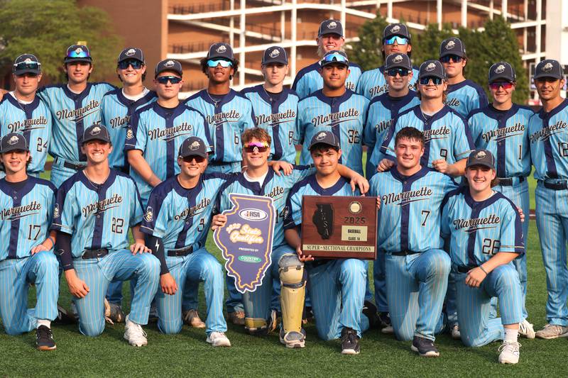 Marquette players hold the super sectional plaque Monday, June 2, 2025, after their Class 1A supersectional win over Fulton at Northern Illinois University in DeKalb.