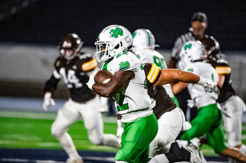 Niles Notre Dame's Deonte Macon runs the ball during a game against Joliet Catholic Academy on Friday Oct. 3, 2025 at Busey Bank Field in Joliet