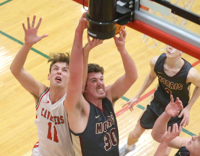 Morris's Cade Lauderman grabs a rebound over L-P's Jameson Hill on Monday, Feb. 9, 2026 in Sellett Gymnasium at L-P High School.