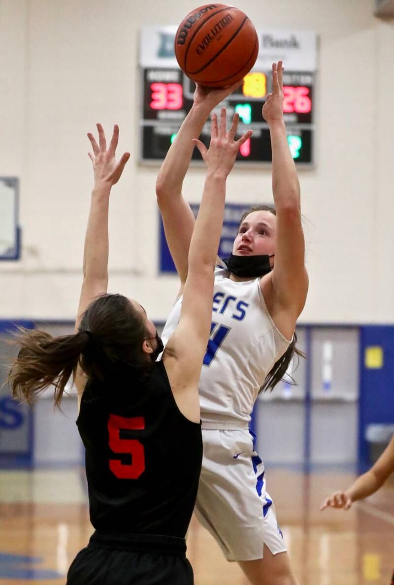 Princeton's McKenzie Hecht shoots over Hall's Promise Giacometti Monday night at Prouty Gym. The Tigresses rallied for a 40-32 victory.