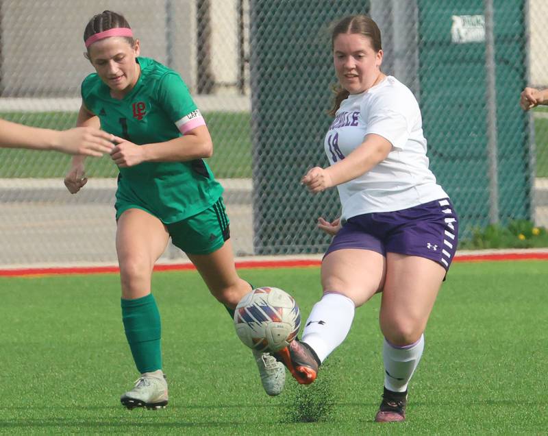 Rochelle's Morgan DeLille kicks the ball down the field away from L-P's Addie Dawson on Wednesday, April 15, 2026 at the L-P Athletic Complex in La Salle.