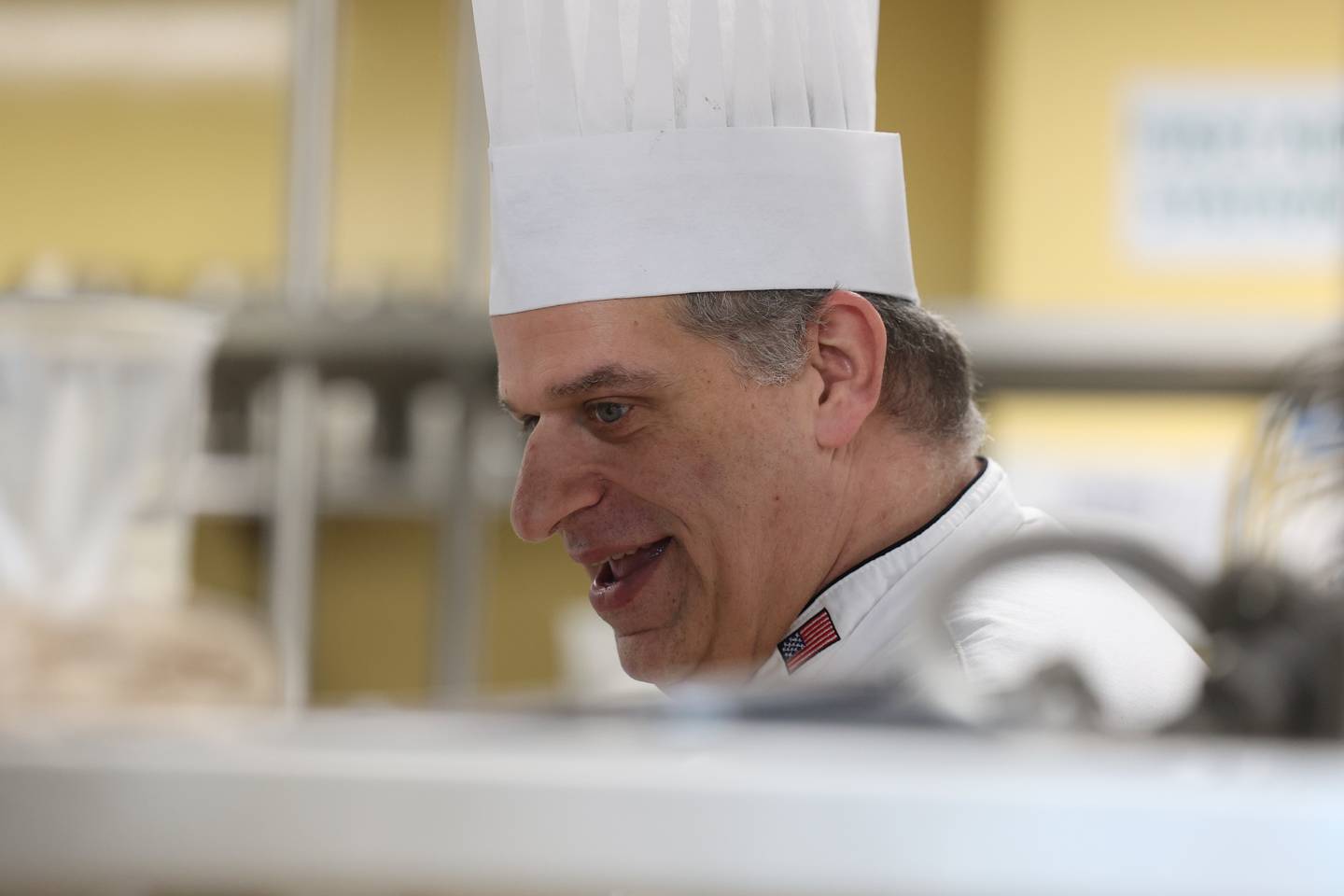 Chef Andy Chlebana works with a student at one of his pastry classes at the Joliet Junior College City Center Campus on Wednesday, March 1st, 2023. Andy has won numerous awards, including 1st place in two competitive television series on the Food Network.