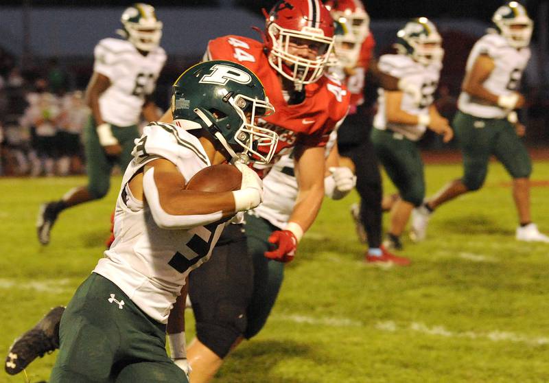 Plainfield Central wide receiver Coly Williams (3) takes a pitch to the outside against Yorkville defender Jake Davies during a varsity football game at Yorkville High School on Friday, Sep. 2, 2022.