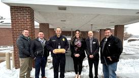 The First National Bank in Amboy donates card skimmer detection devices to Dixon Police Department
