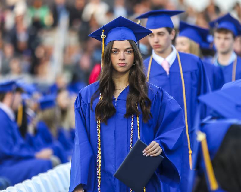 At student heads back to her seat after receiving her diploma at the Lyons Township High School Graduation ceremony Wednesday, May 28, 2025  in Western Springs.