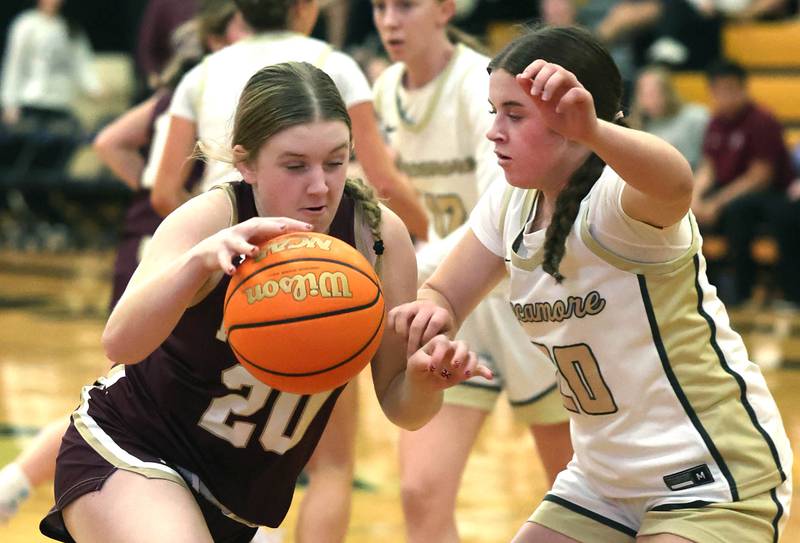Morris’ Brynne Thorson goes to the basket against Sycamore's Callie Countryman during their game Tuesday, Jan. 13, 2026, at Sycamore High School.