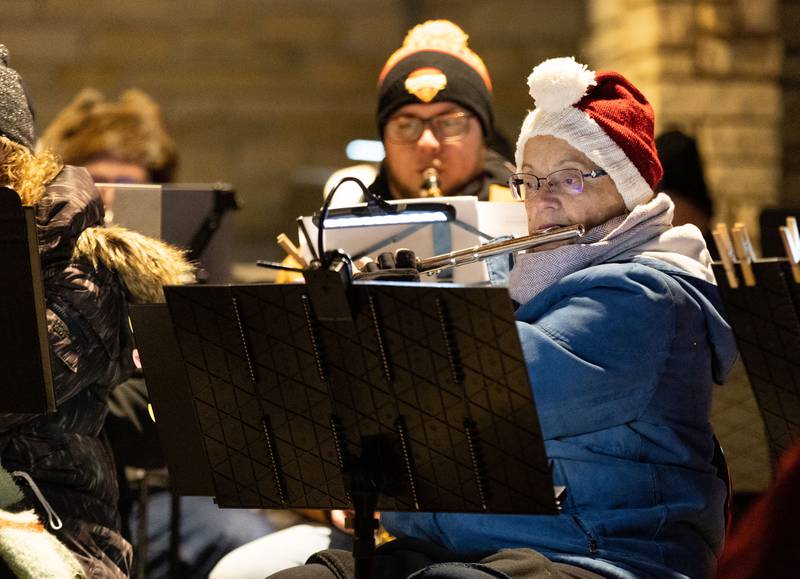Batavia Community Band member Anna Sedberry performs Christmas carols during the Celebration of Lights at the Batavia Riverwalk on Sunday, Dec. 1, 2024.