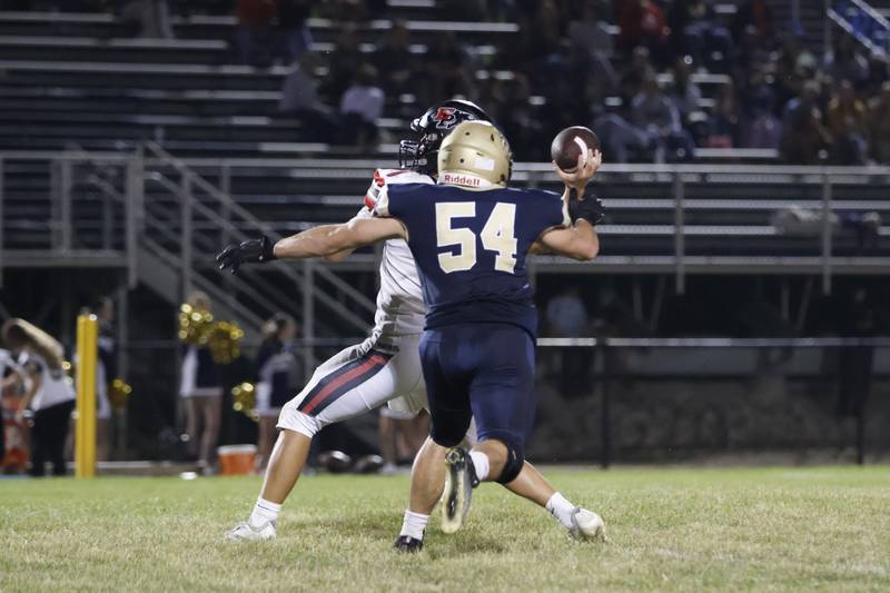 Golden Eagles #54 Eli Burns just missed a sack on Panthers quarterback #1 Keegan Winckler Friday night at the Golden Eagles homefield in Aledo.