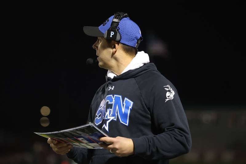 St. Charles North head coach Robert Pomazak walks the sidelines against Brother Rice in the third round of the playoffs on Saturday, Nov. 15, 2025 in Chicago.