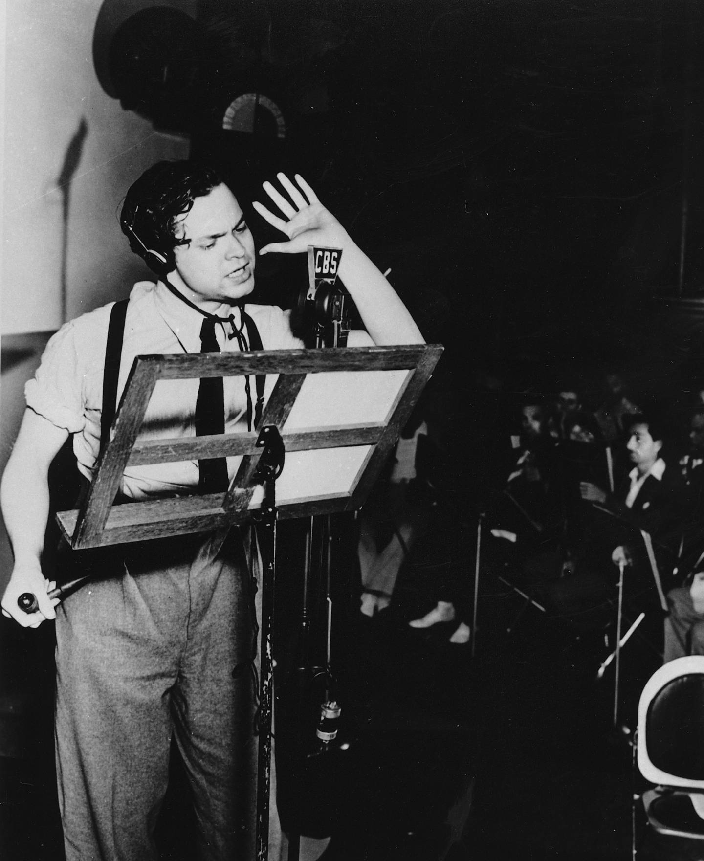 Orson Welles broadcasts his radio show of H.G. Wells' science fiction novel "The War of the Worlds" in a New York studio at 8 p.m. Sunday, Oct. 30, 1938.  The realistic account of an invasion from Mars caused thousands of listeners to panic.