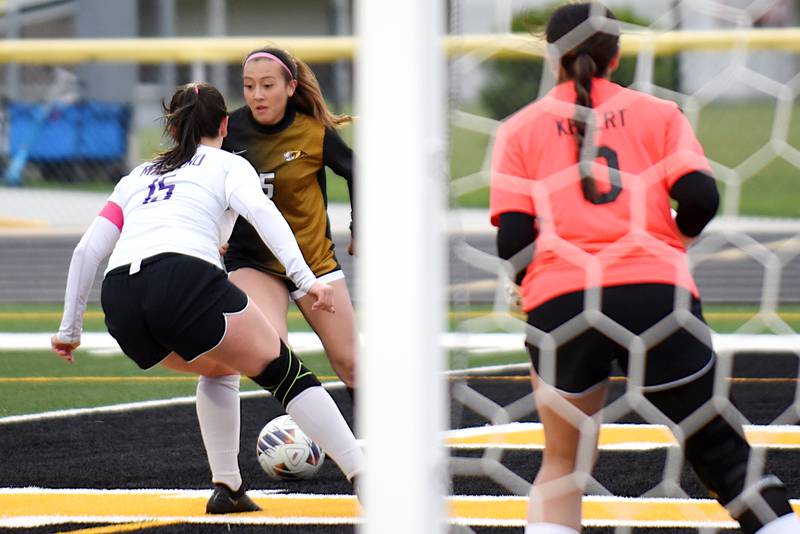 Herscher's Gianni Jaime (5) looks to work around Manteno's Miranda Lingo, left, as Panthers goalkeeper Avery Kebert looks on during a game at Herscher Tuesday, May 5, 2026.
