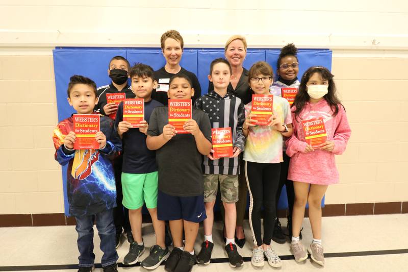 The Rotary Club of Joliet recently donated over 2,000 dictionaries to all Joliet Public Schools District 86 third and fourth grade students. Rotary members Gloria Dollinger and Jen Howard are pictured with students at Eisenhower Academy.
