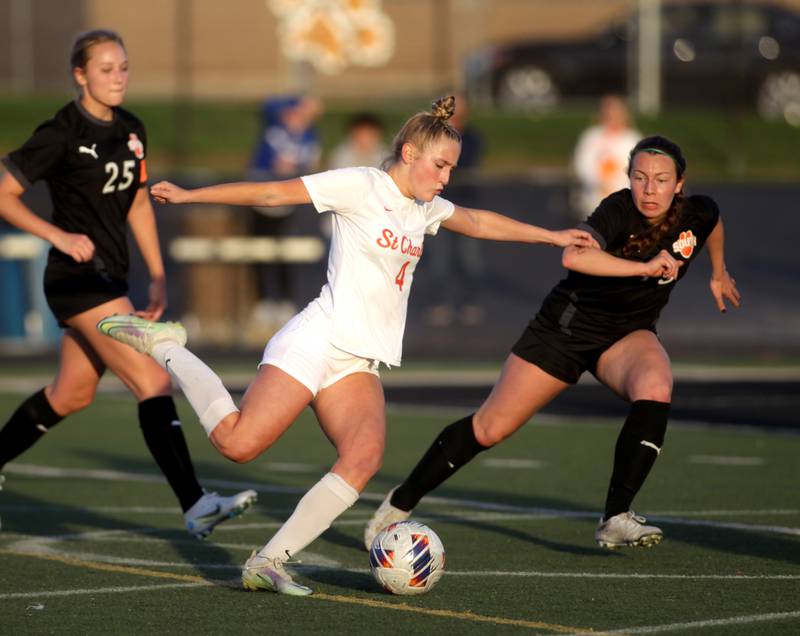 St. Charles East’s Grace Williams kicks the ball for a goal during a game at Wheaton Warrenville South on Tuesday, April 18, 2023.