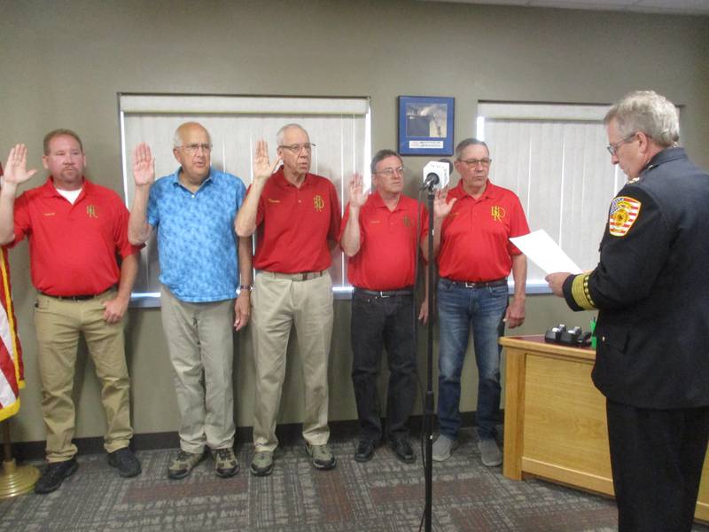 Newly elected Bristol-Kendall Fire Protection District trustees take the oath of office on May 15, 2023 from fire Chief Jim Bateman. They are, from left, Darrin Peterson, Gary Schlapp, Ken Johnson, Jeff Farren and Marty Schwartz.