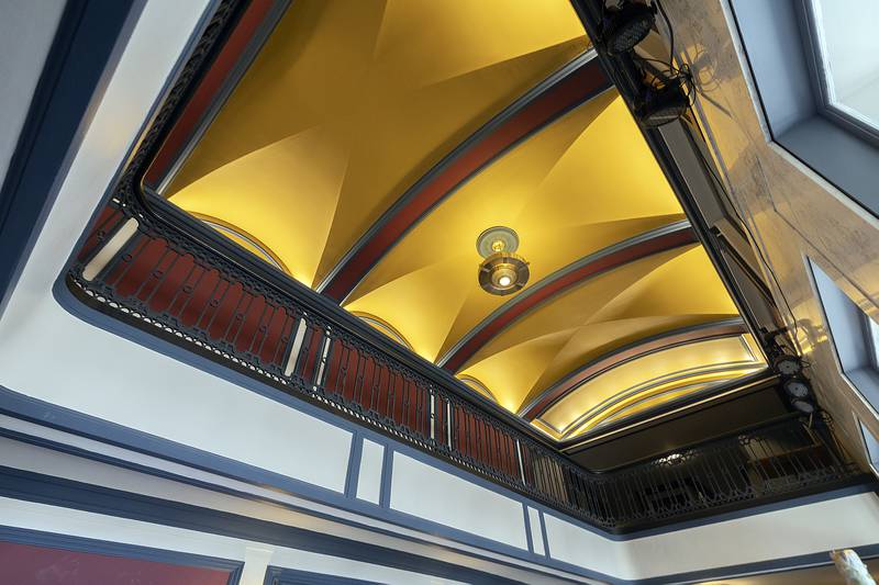 The walls, railings and ceilings have all been painted for The Dixon renovation as seen Tuesday, Feb. 18, 2025. Plaster work, roof work and tuck pointing were all also part of the recent rehab.