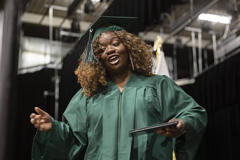 Desiree Johnson smiles while crossing the stage Sunday, May 28, 2023 at Rock Falls High School’s 144th commencement ceremony.