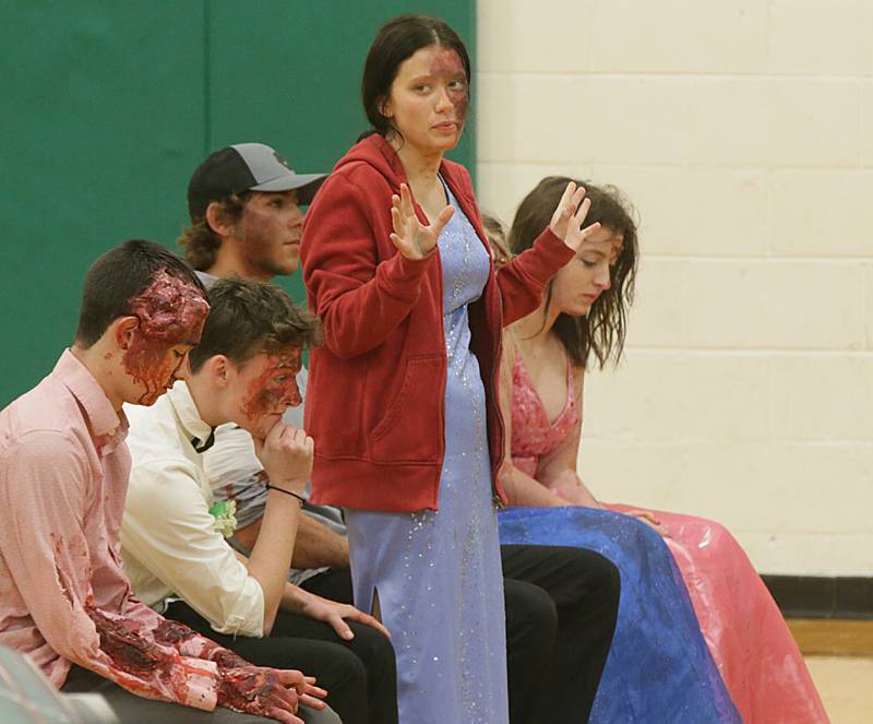 Jessica Barry a student at Leland High School, speaks to classmates on her experience after participating in a Mock Prom drill at Leland High School on Friday, May 6, 2022 in Leland.