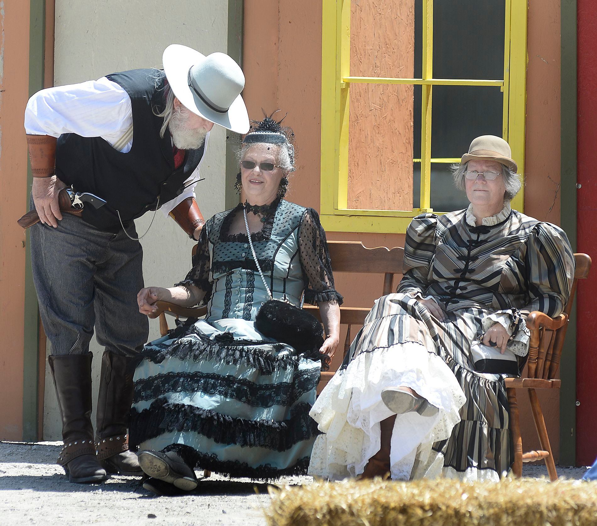 Actors in the Old West Regulators perform a scene outside a saloon during a reenactment Saturday, May 27, 2023, at Wild Bill Days in Utica.