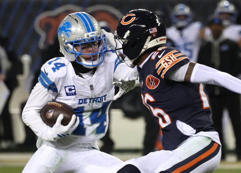 Detroit Lions wide receiver Amon-Ra St. Brown makes a big catch late in the fourth quarter in front of Chicago Bears cornerback Nahshon Wright during their game Sunday, Jan. 4, 2026, at Soldier Field in Chicago.