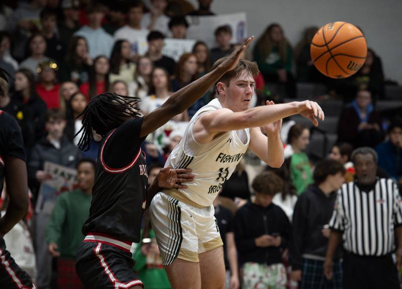 Bishop McNamara's Teddy Fogel, right, passes the ball in a game against Chicago Bulls Prep on Friday, December 19, 2025.
