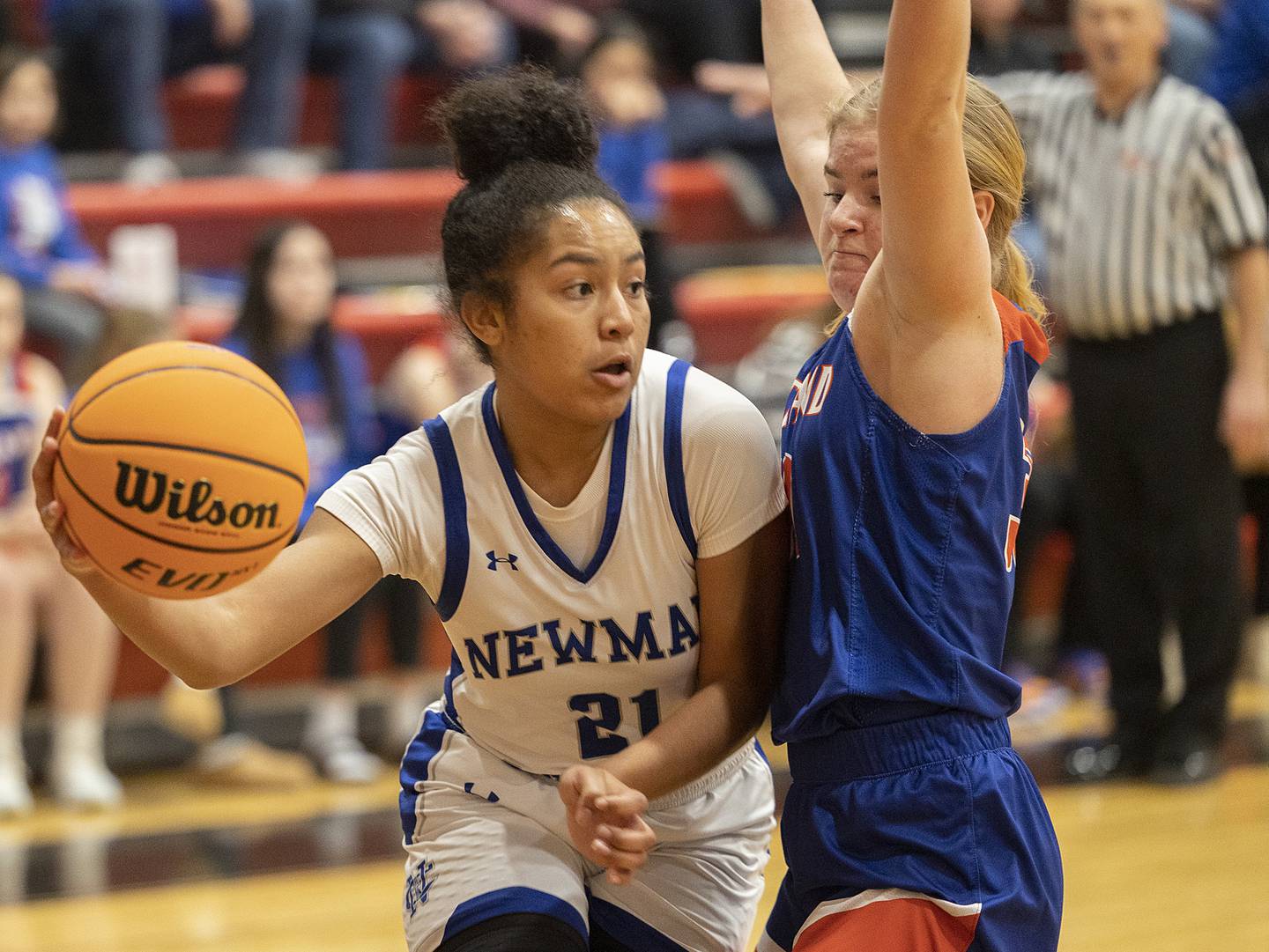 Newman’s Gisselle Martin makes a pass while being guarded by Eastland’s Morgan McCullough Tuesday, Feb. 18, 2025, during the Class 1A girls basketball regional at Forreston.